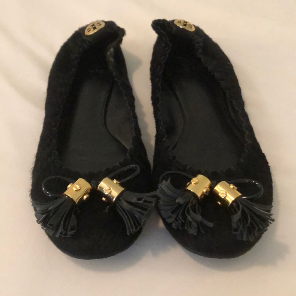 Black, calf hair Tory Burch tassel flats.